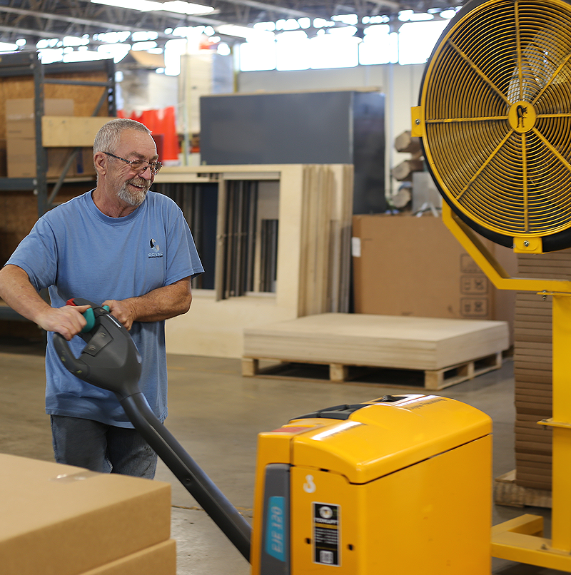 worker moving the printed product